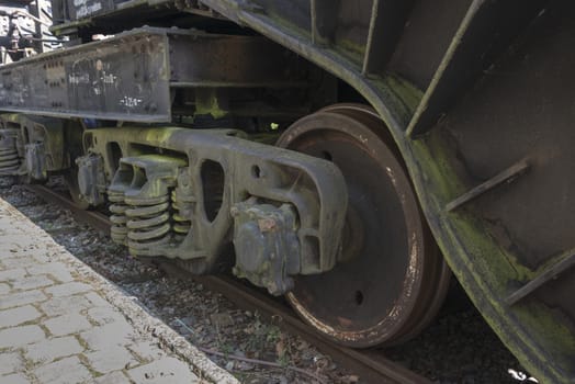 old rusted dirty wheels from train on railroad