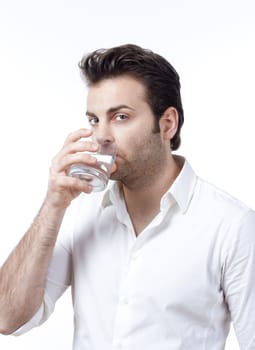 man in shirt holding glass of water looking up - isolated on white