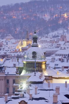 prague - winter view of lesser town rooftops covered with snow