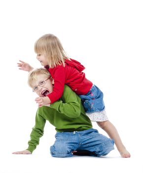 two young siblings fooling around with each other - isolated on white