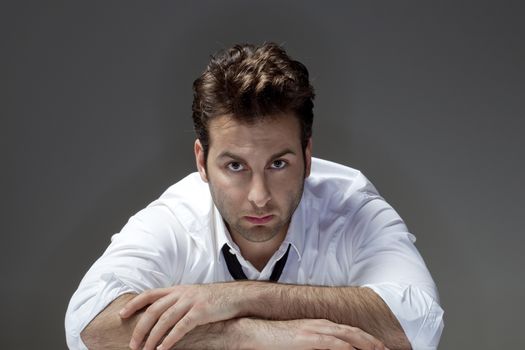 man in white shirt and tie looking, thinking - isolated on gray