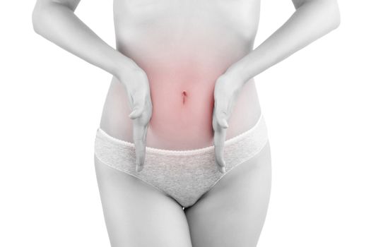 Stomach pain. Beautiful woman touching her belly in grey panties isolated on white background. Menstruation, period, pregnancy. Feminine health & digestive problems.