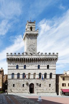 Image of town hall Montepulciano Tuscany, Italy with blue sky and white clouds