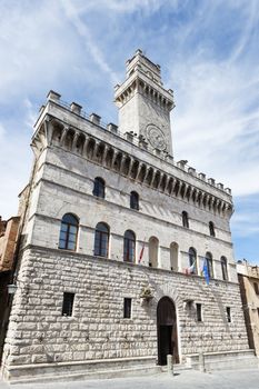 Image of town hall Montepulciano Tuscany, Italy with blue sky and white clouds