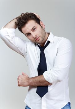 businessman in white shirt and tie, concerned, worried - isolated on gray