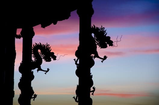 Dragon statue row the column silhouette with nice twilight sky