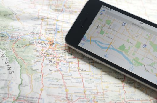 Smartphone with GPS navigator on map 