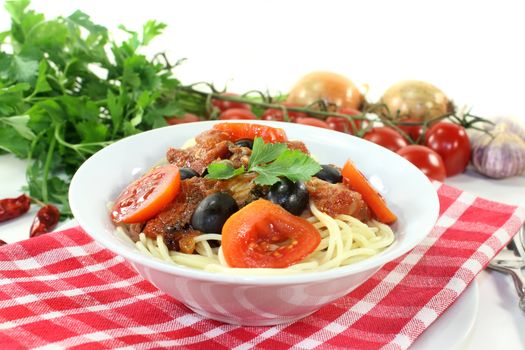 Capellini with tomatoes, anchovies, capers and olives