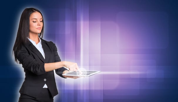 Beautiful businesswomen in suit using digital tablet. Technology concept