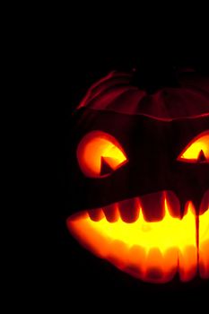 Halloween pumpkin with scary face on black backgound