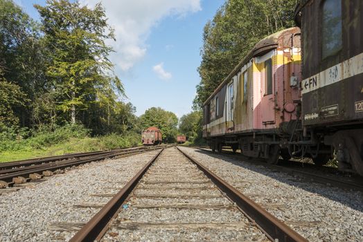 railroad track with old trains in belgium city hombourg