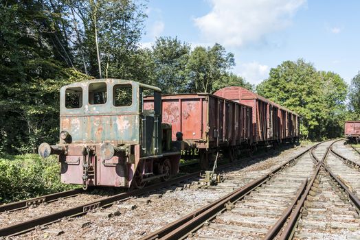 old rusted train with locomotive at trainstation hombourg in belgium