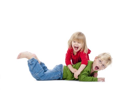 two young siblings fooling around with each other - isolated on white