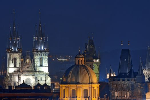 czech republic, prague - spires of the old town and tyn church at dusk