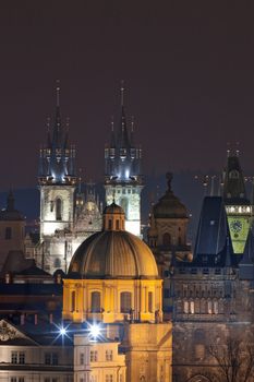 czech republic, prague - spires of the old town and tyn church at dusk