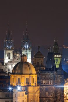 czech republic, prague - spires of the old town and tyn church at dusk