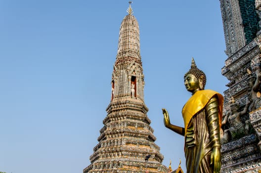 The statue of Golden Buddha in Wat Arun.  Thai traditional Buddhist architecture in Bangkok, Thailand