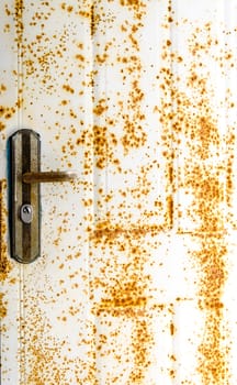 Old door and rust on white door
