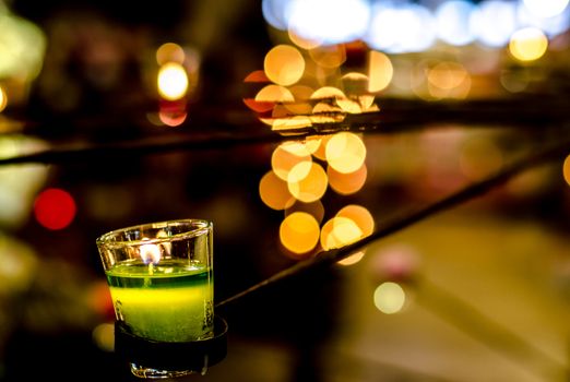The Green candle on bokeh background