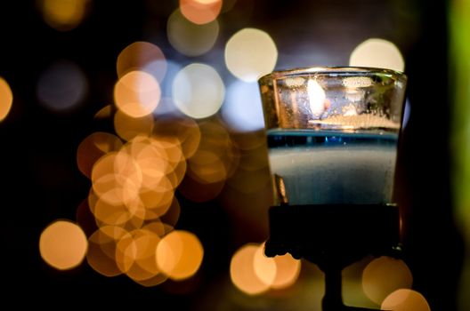 The Blue candle on bokeh background