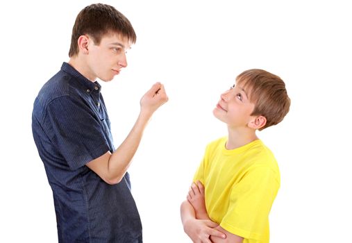 Teenager threaten a Naughty Kid with a Fist on the White Background