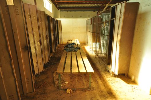 A dusty, dirty locker and change room at a decommissioned gold mine.