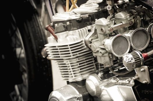 powerful motorcycle carburetor and engine parts closeup