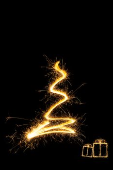 Merry christmas. Sparkling firework christmas tree with christmas presents. Minimal abstract artistic style.