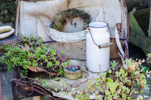 Garden beautiful little corner,
 little old garden table with various little things.
