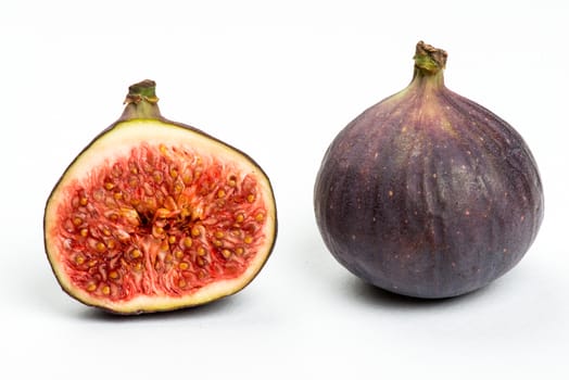 Collection of fresh ripe figs on white background