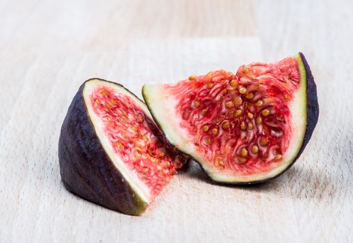 Collection of fresh ripe figs on wood background