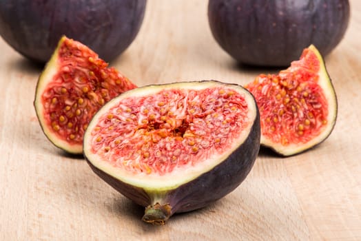 Collection of fresh ripe figs on wood background