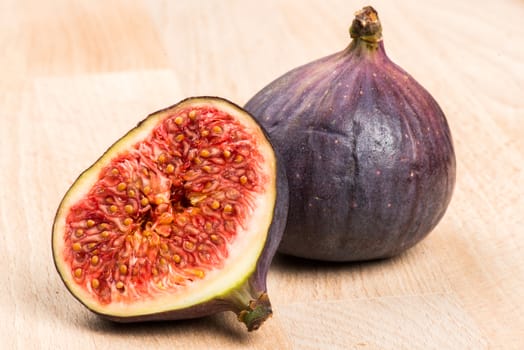 Collection of fresh ripe figs on wood background
