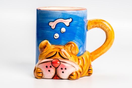 Yellow ceramic mug with dog  on white background