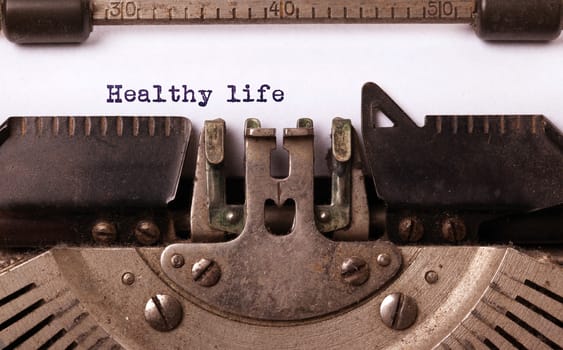 Vintage inscription made by old typewriter, healthy life