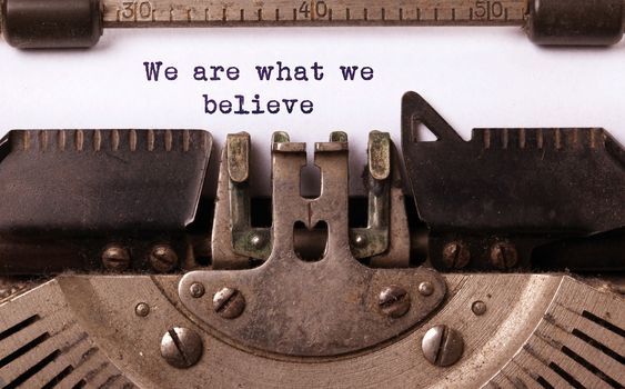 Vintage inscription made by old typewriter, we are what we believe