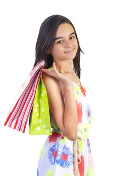 shopping teenager girl smiling holding shopping bags. closeup portrait of beautiful young