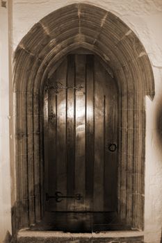 door at the chapel of Holycross abbey county Tipperary Ireland in sepia