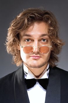 Portrait of a Young Man with Glasses in Tuxedo