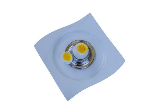 Breakfast egg on a plate against a white background