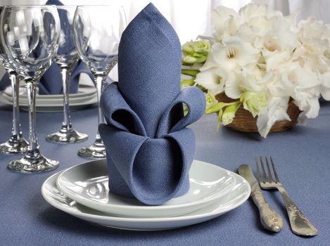 Fragment table setting decorated with flower napkin