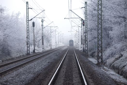 Railroad tracks in winter fog