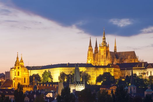 czech republic, prague - hradcany castle and st. nicolaus church at dusk