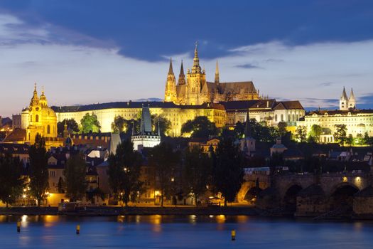 czech republic, prague - charles bridge and hradcany castle at dusk