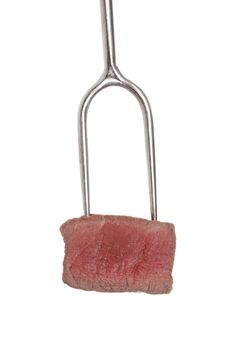 Delicious juicy steak on bbq fork isolated on white background. Filet mignon, culinary steak eating. 