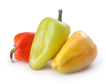 Three fresh peppers on the white background