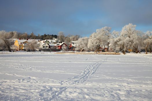 Winter landscape with frozen lake