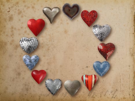 Photo of metal heart-shaped things organized in a circle over vintage paper background.
