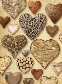 Background of heart-shaped things made of wood on vintage paper background.
