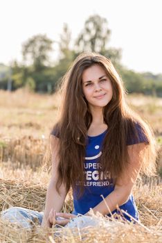 a Teen girl resting in a field